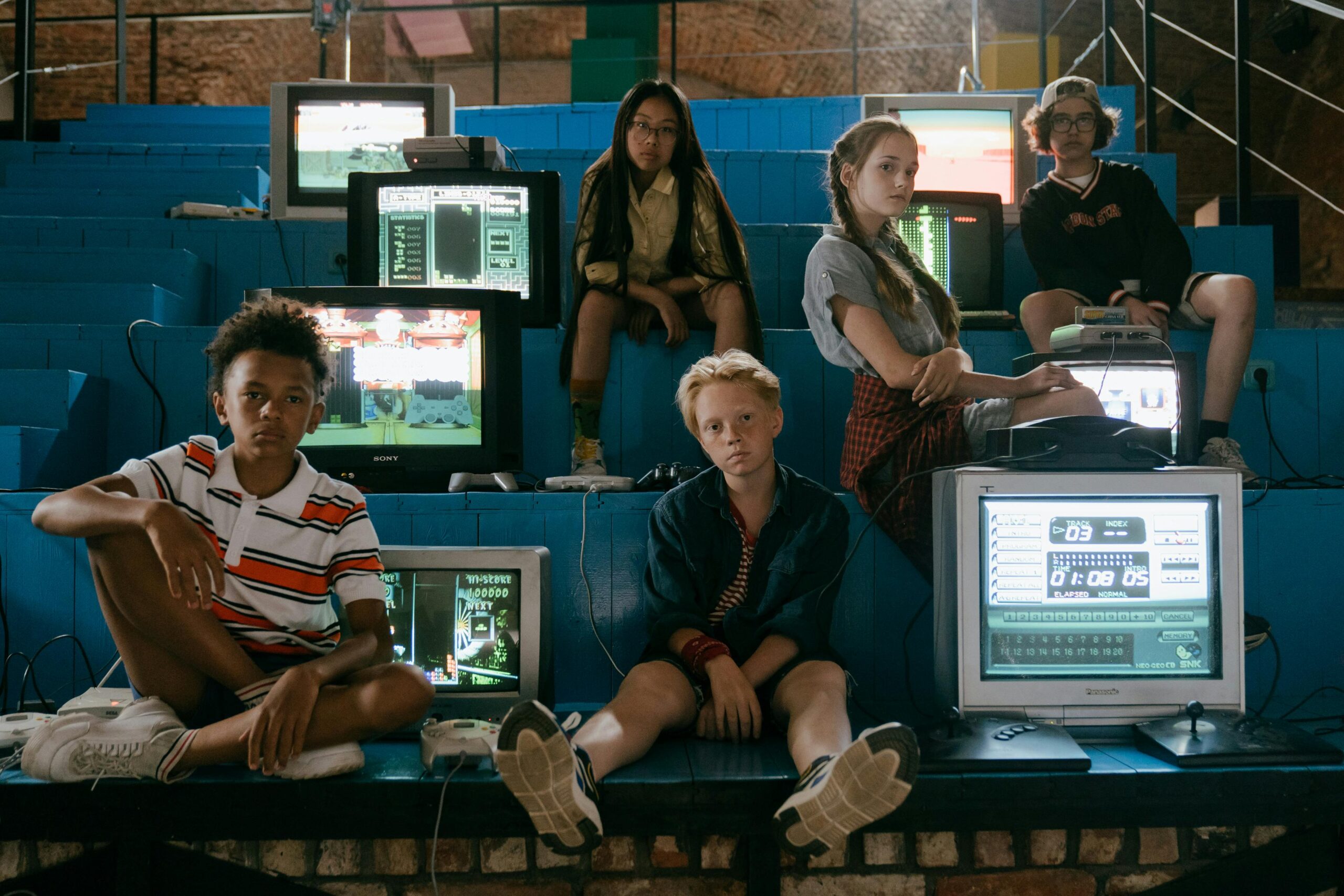 Teenagers enjoying retro video games in a nostalgic setting with vintage TVs and consoles.
